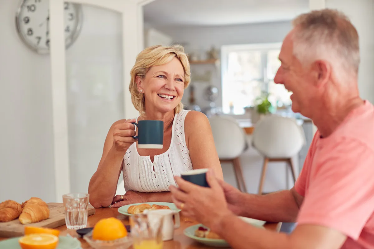 55 plus couple eating breakfast in a new home in Ocala